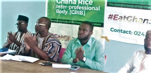  Nana Adjei Ayeh (2nd from left), National President of GRIB, applauding at the event. With him are Dauda A. Salam (left), Northern Regional Crop Officer, and some officials of GRIB